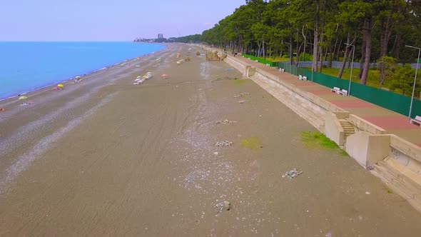 View from drone to beach along sea with green vegetation. Georgia. Kobuleti. alt