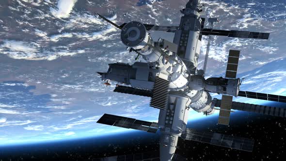 Flight Of The Space Station Above The Earth alt