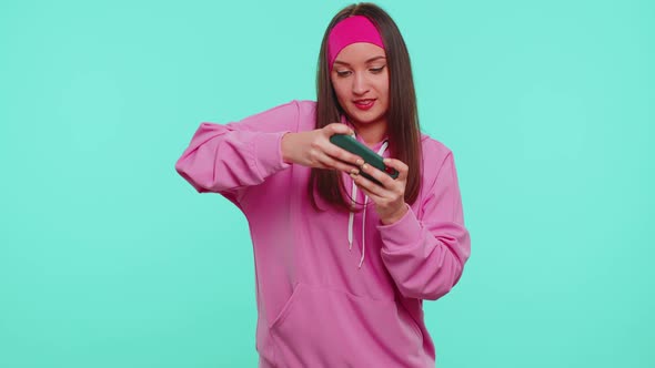 Worried Funny Addicted Woman Girl Enthusiastically Playing Drive Racing Video Games on Mobile Phone alt