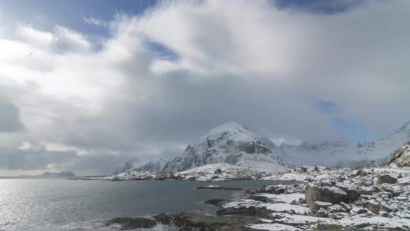 Clouds moving over the icebergs in Norway winter. alt