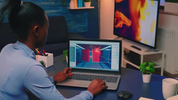 Young African Woman Gamer Testing Online Professional Game on Laptop alt