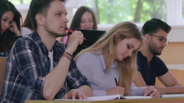 Students Writing in University alt