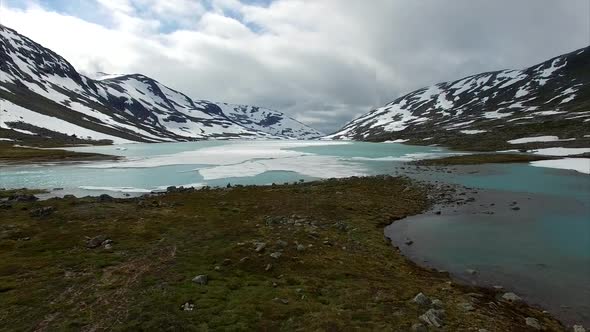 Frozen lake in mountain pass in Norway alt