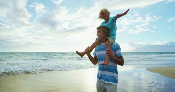 Father and Son Playing with Sparklers alt