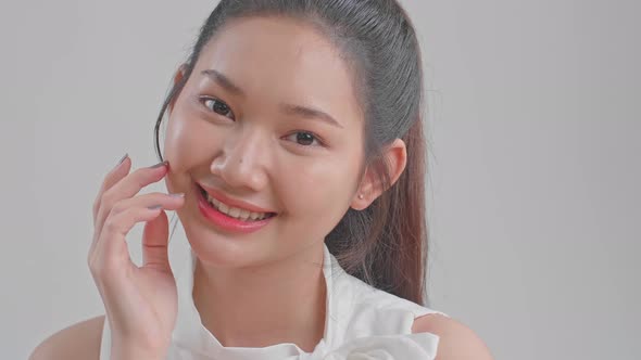 Beautiful Woman Cares For The Skin Face Posing At Studio alt