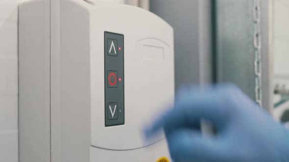 Worker Opens the Gate in the Warehouse alt