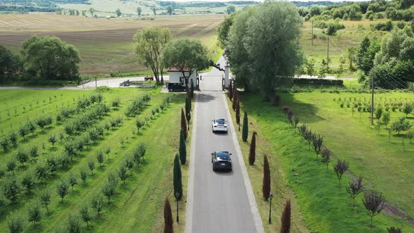 Aerial View Autonomous Self Driving Electric Car Moving Through Road With Trees alt