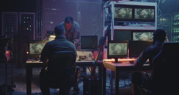Soldiers Following Car Movement on Computers alt