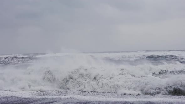 White Waves Crashing To Shore Of Black Sand Beach alt