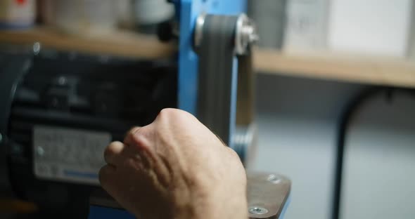 Carpenter Uses Belt Sander at His Workshop for Processing the Small Timber Items  60p 10 Bit alt