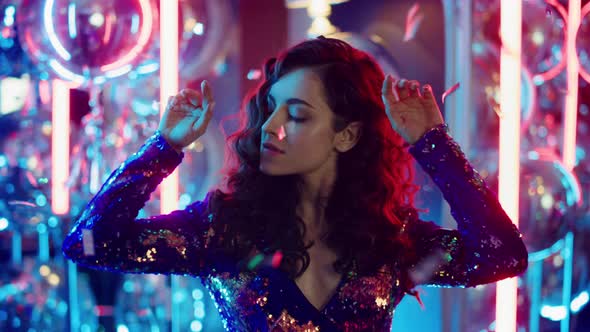 Sexy Woman Looking at Camera at Party. Attractive Girl Dancing in Nightclub alt