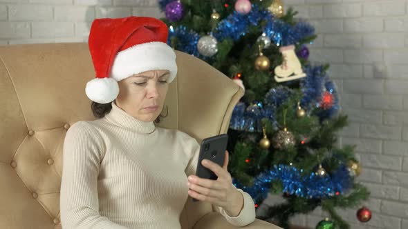 Stressed Woman with Phone in Christmas Room alt