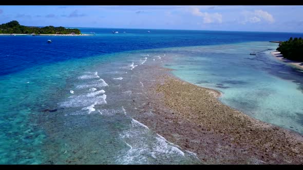 Aerial drone shot seascape of marine island beach trip by blue green water and white sand background alt