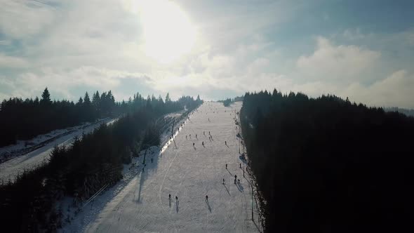 Aerial panoramic view of Topolita Snow Summit, in Transylvania, Romania, during winter with lots of alt