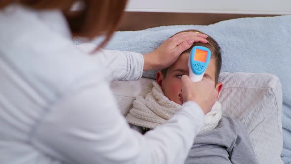 l Child with Symptoms of Disease Caring Male Parent Measures High Temperature in Celsius with alt