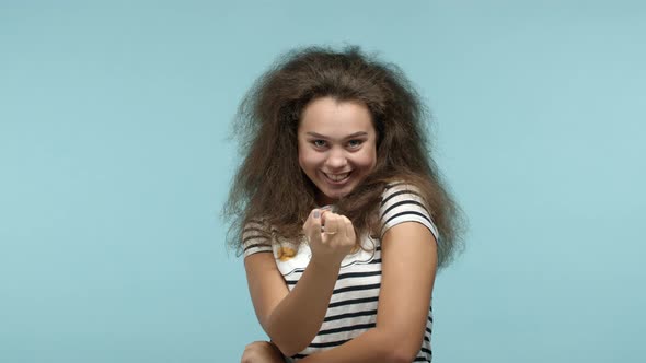 Young Seductive Woman Beckon you Flirty with Finger Asking to Come Closer and Smiling Luring Someone alt