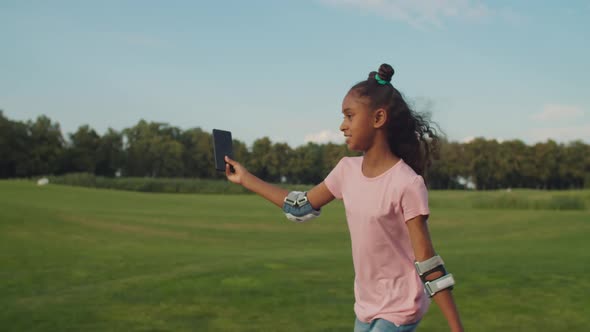 Cute Teenage Girl on Roller Blades Vlogging Online alt