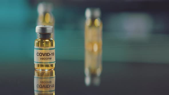 Corona virus cure or vaccine in an injection bottle. alt