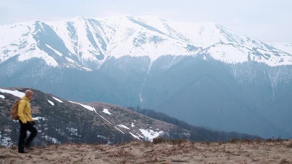 Man with Backpack in Spring Mountains