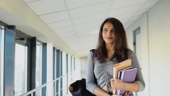 Pakistani Woman Student with a Books in the University alt