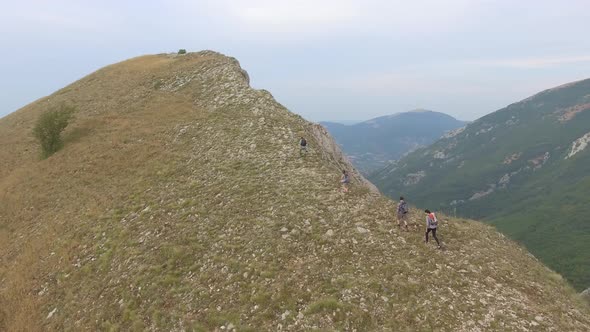 Group of four friends hiking in Umbria, Italy