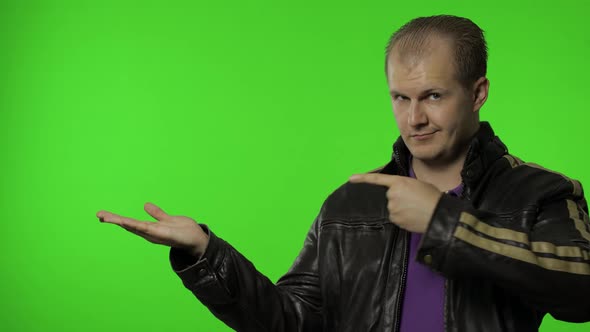 Man Showing Advertising Area. Looking Shocked, Pointing with Hands for Your Promotional Text, Logo alt