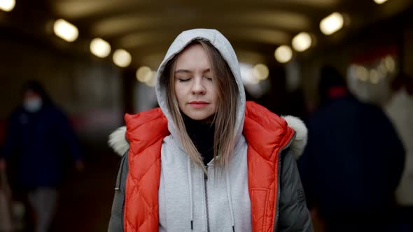 Tired and Scared Woman in Underground Entrance in Big City Portrait of Townswoman in Crowd alt