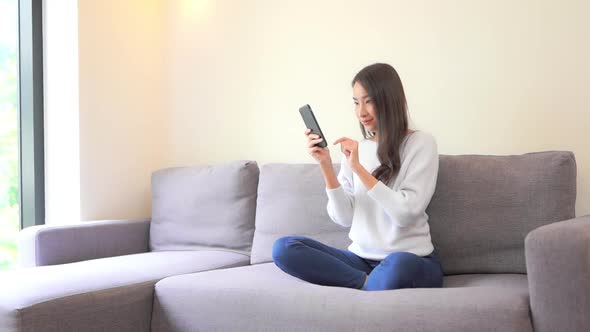 Young asian woman use smart phone