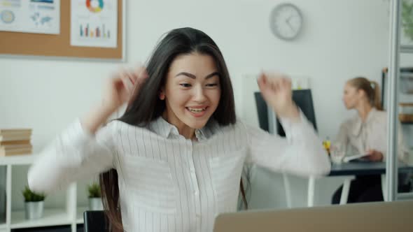 Cheerful Asian Woman Working with Laptop Then Enjoying Success Dancing Having Fun alt