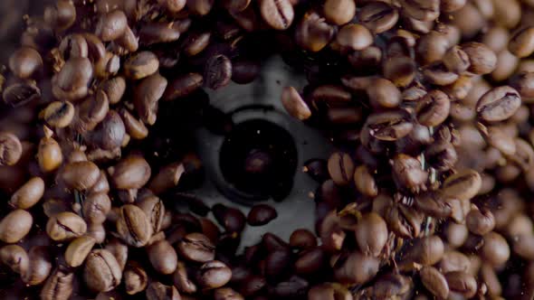 Fragrant Coffee Grains Grinding in Electric Grinder Top View Close Up alt