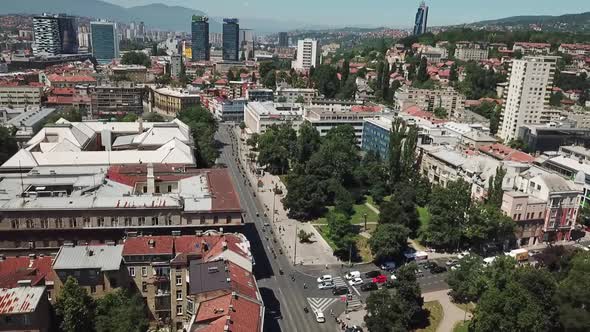 Bikers Driving Across The City Center V1 alt