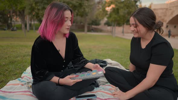 Friends in the Park Having a Conversation About Makeup Palette Colors alt