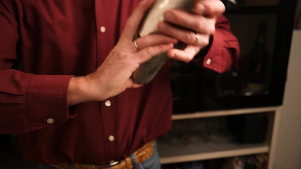 Bartender Shake cocktails with steel shaker in slow motion.