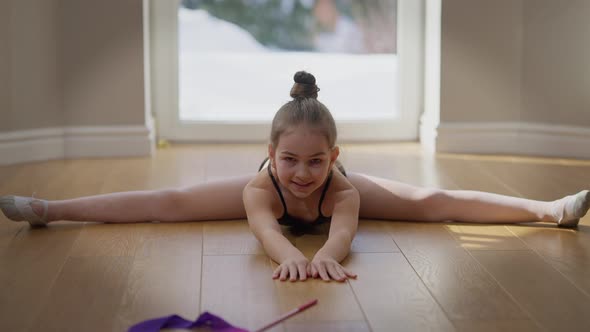 Front View Portrait of Confident Motivated Teenage Gymnast Looking at Camera Bending Forward on alt