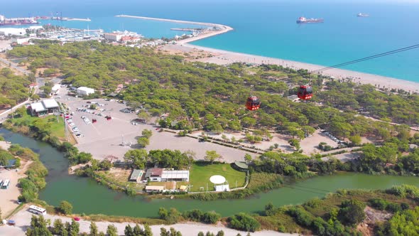 Close-up Flight Next To the Uphill Funicular with the Coast in the Background  alt