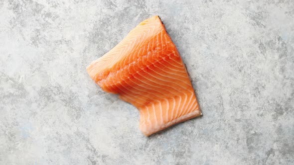 Raw Fresh Salmon Meat Placed on Gray Stone Background alt