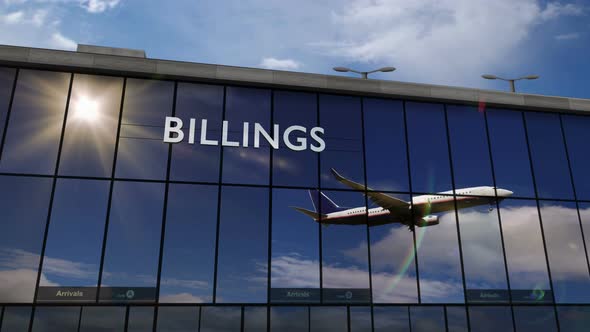 Airplane landing at Billings Montana, USA airport mirrored in terminal alt