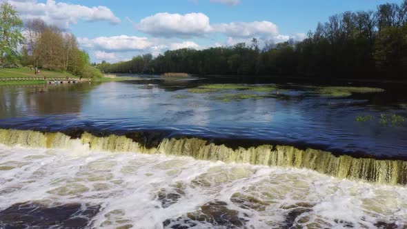 Flying Fish at Ventas Rumba The Widest Waterfall in Europe in Latvia Kuldiga, Aerial Dron Shot alt