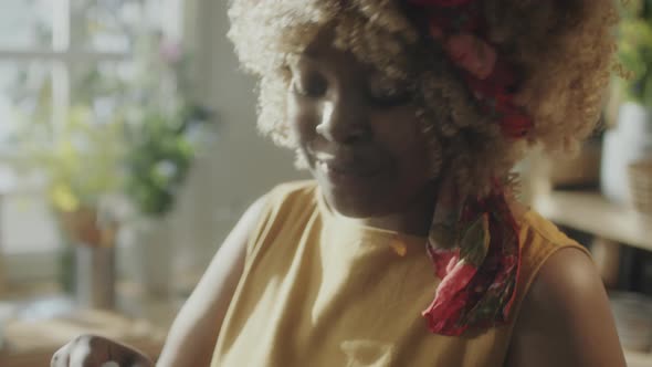 Female Food Blogger Cooking Pesto Sauce on Camera alt