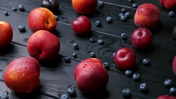 Nectarines Sweet Cherries Blueberries on a Wooden Table Autumn Fall Harvest in Summer alt