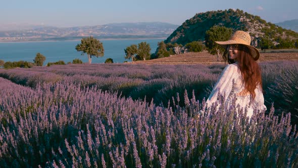 Girl Walks Near Purple Lavender Field alt