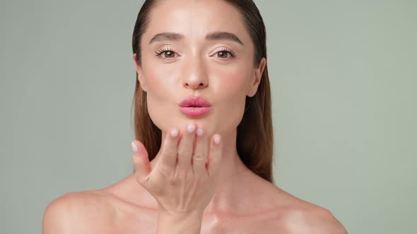 Beautiful Young Woman with Clean Fresh Skin Standing Over Light Grey Background alt
