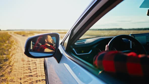 Man of a Car While Driving alt