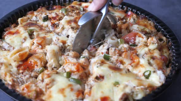 Women Cutting Pasta with Cutter  alt
