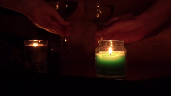 The Guy and the Girl Drink Wine By Candlelight in the Evening Near the Bed alt