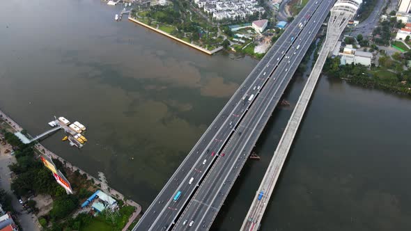 Aerial view overlooking Cau Sai Gon bridge revealing skyscrapers in the Phuong 22 district of Ho chi alt