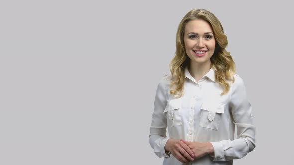 Presenter Talking About Your Product Isolated on Grey Background alt