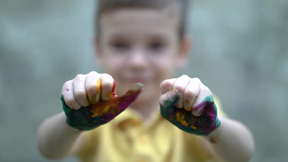 Boy Covered in Finger Paint
