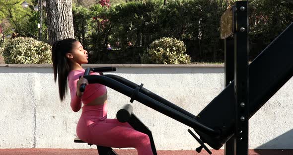 Young black woman doing gym exercise outdoor.