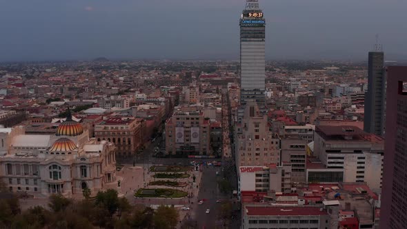 Drone Camera Slowly Moving Forward to Torre Latinoamericana Tall Building Around Palacio De Bellas alt